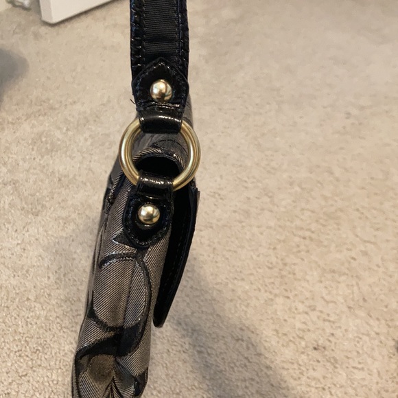 Black, gray, gold coach purse. Small scratch shown on buckle in picture. - Picture 3 of 8
